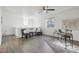 Bright bonus room with wood floors, a ceiling fan, modern decor and plenty of natural light from the window at 18079 E 108Th Pl, Commerce City, CO 80022