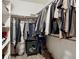 Walk-in closet with clothing rack, shelving, and grey wood look tile floors at 18079 E 108Th Pl, Commerce City, CO 80022