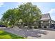 Community clubhouse featuring a covered patio and manicured landscaping at 18079 E 108Th Pl, Commerce City, CO 80022