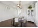 Bright dining area featuring modern lighting, a stylish table with bench seating, and ample natural light at 18079 E 108Th Pl, Commerce City, CO 80022