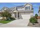 Charming two-story home with a two-car garage, solar panels, and well-maintained landscaping at 18079 E 108Th Pl, Commerce City, CO 80022