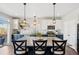Bright kitchen with a large island, granite countertops, stainless steel appliances, and modern pendant lighting at 18079 E 108Th Pl, Commerce City, CO 80022