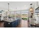 Bright kitchen features stainless steel appliances, granite countertops, and an island with pendant lighting at 18079 E 108Th Pl, Commerce City, CO 80022