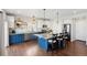 Modern kitchen with a spacious island, granite countertops, stainless steel appliances, and pendant lighting at 18079 E 108Th Pl, Commerce City, CO 80022