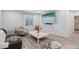 Bright and airy living room featuring modern decor, a large flat-screen TV, and comfortable seating at 18079 E 108Th Pl, Commerce City, CO 80022