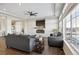 Cozy living room with recessed lighting, a fireplace, large windows, and comfortable seating at 18079 E 108Th Pl, Commerce City, CO 80022