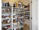 Walk-in pantry with lots of shelving offers ample storage space for food and supplies at 18079 E 108Th Pl, Commerce City, CO 80022