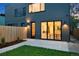 Backyard with a concrete patio and sliding glass doors at 2450 S Cherokee St, Denver, CO 80223