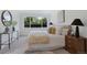 Bright bedroom with a large window and modern decor at 2450 S Cherokee St, Denver, CO 80223