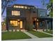 Modern two-story home boasting a rooftop deck and sleek contemporary design with a manicured lawn at 2450 S Cherokee St, Denver, CO 80223