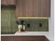 Contemporary kitchen with stylish backsplash and wooden cabinets at 2450 S Cherokee St, Denver, CO 80223