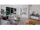 Bright and open living room with a modern fireplace and large sliding glass doors at 2450 S Cherokee St, Denver, CO 80223