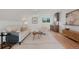 Comfortable living room with vaulted ceiling, wood floors, wet bar and a large window view at 2450 S Cherokee St, Denver, CO 80223