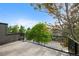 Enjoy neighborhood views from this outdoor rooftop deck with modern black railing at 2450 S Cherokee St, Denver, CO 80223