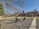Large backyard featuring a brick patio with a fire pit and seating at 3361 W Saratoga Ave, Englewood, CO 80110