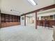 Large finished basement features carpet flooring, bar area, and ample space at 3361 W Saratoga Ave, Englewood, CO 80110