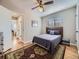 Comfortable bedroom with wood floors, ceiling fan, and a decorative rug at 3361 W Saratoga Ave, Englewood, CO 80110