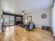 Bright living room features hardwood floors, stone fireplace, and large windows for natural light at 3361 W Saratoga Ave, Englewood, CO 80110