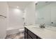 Clean bathroom with white subway tile, modern fixtures, a bathtub, and vanity with countertop sink at 4619 Windmill Dr, Brighton, CO 80601
