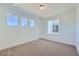 Bright bedroom with three large windows providing ample natural light and views of the surroundings at 4619 Windmill Dr, Brighton, CO 80601