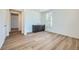 Bonus room features a wet bar with dark cabinets, light countertops, and wood flooring at 4619 Windmill Dr, Brighton, CO 80601