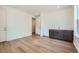 Bonus room features a wet bar with dark cabinets, light countertops, and wood flooring at 4619 Windmill Dr, Brighton, CO 80601