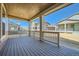 Inviting covered patio offers an outdoor living space with views of the neighborhood and beautiful blue skies at 4619 Windmill Dr, Brighton, CO 80601