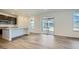 Kitchen with dark cabinets, white countertops, stainless steel appliances, and a glass door to an outdoor patio at 4619 Windmill Dr, Brighton, CO 80601