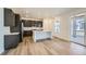 Modern kitchen featuring dark cabinets, white countertops, stainless steel appliances, and a center island at 4619 Windmill Dr, Brighton, CO 80601