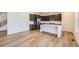 Modern kitchen featuring dark cabinets, stainless steel appliances and a white countertop island at 4619 Windmill Dr, Brighton, CO 80601