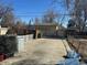 Backyard featuring a concrete pad and fencing, with a lawn in the background at 1120 Dayton St, Aurora, CO 80010