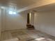 Spacious basement with light tile floors and recessed lighting at 1120 Dayton St, Aurora, CO 80010