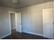 Neutral bedroom featuring two closets, hardwood floors and fresh paint creating a relaxing space at 1120 Dayton St, Aurora, CO 80010