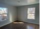 Comfortable bedroom featuring wood floors and two windows, providing natural light at 1120 Dayton St, Aurora, CO 80010
