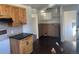 Kitchen area with wooden cabinets and countertop space, with wood floors at 1120 Dayton St, Aurora, CO 80010