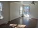 Roomy living area with fresh paint, wood floors, and dual windows at 1120 Dayton St, Aurora, CO 80010
