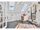 Cozy attic space featuring skylights, black floors, and a colorful rug at 377 S Grant St, Denver, CO 80209