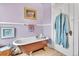 Stylish bathroom featuring a vintage clawfoot tub, lavender walls, and elegant decor at 377 S Grant St, Denver, CO 80209