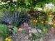 A landscaped garden area with flowers, plants, and tree at 377 S Grant St, Denver, CO 80209