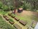Aerial view of backyard featuring an outbuilding, vegetable garden, and lush greenery at 9716 Canon Dr, Sedalia, CO 80135