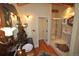 A bathroom featuring dual vanities, a glass enclosed shower, tile floors, and warm lighting at 9716 Canon Dr, Sedalia, CO 80135