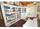 Cozy living room with built-in bookcase, sofa, and a corner window offering natural light at 9716 Canon Dr, Sedalia, CO 80135