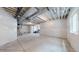 Spacious unfinished basement ready for customization with concrete floor and white wrapped walls at 3625 Silver Rock Cir, Castle Rock, CO 80104