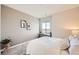 Cozy bedroom with a glass desk by a window, soft carpet, and simple decor at 3625 Silver Rock Cir, Castle Rock, CO 80104