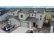 Exterior elevation shot showing the driveway and the two-story facade at 3625 Silver Rock Cir, Castle Rock, CO 80104