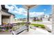 Inviting front porch with a seating bench and flower planters, overlooking the landscaped street at 3625 Silver Rock Cir, Castle Rock, CO 80104