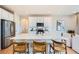 Bright kitchen with stainless steel appliances, a large center island, and seating for casual dining at 3625 Silver Rock Cir, Castle Rock, CO 80104