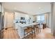 Modern kitchen featuring white cabinets, stainless steel appliances, and an island with bar seating at 3625 Silver Rock Cir, Castle Rock, CO 80104