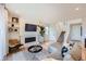 Comfortable living room featuring a fireplace, hardwood floors, and staircase to the upper level at 3625 Silver Rock Cir, Castle Rock, CO 80104