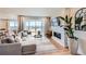 Bright living room boasts a modern fireplace, hardwood floors, and sliding glass doors to the backyard at 3625 Silver Rock Cir, Castle Rock, CO 80104